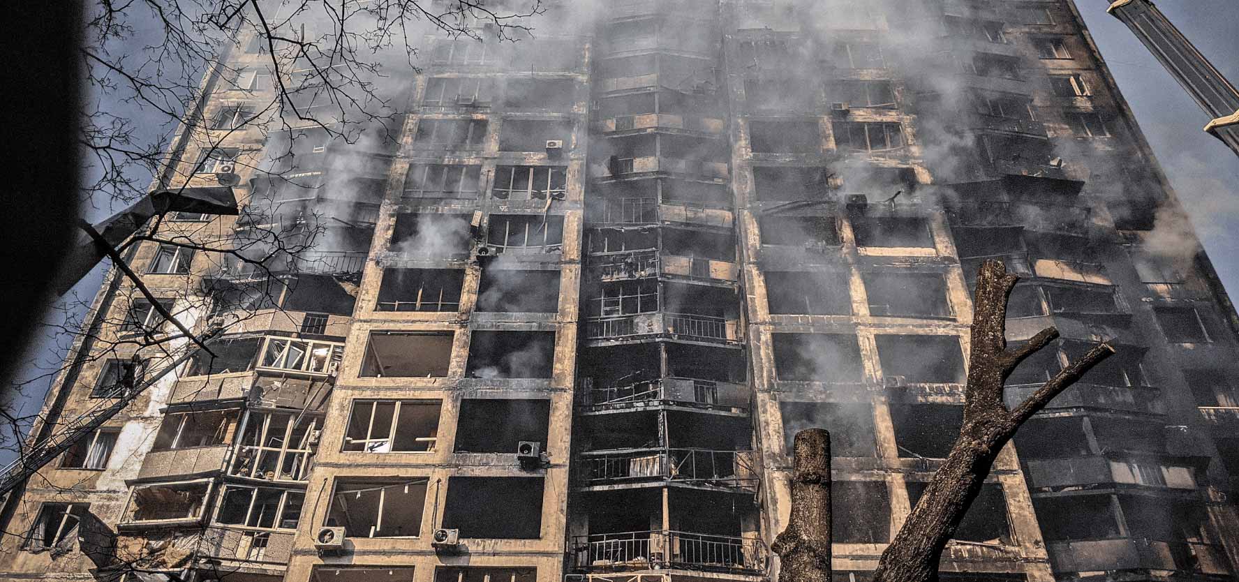 An image of a smouldering building in Kyiv.